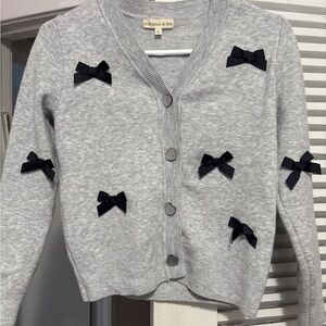 Margaux and Lexi Kids' Bow Cardigan in light grey heather and acrylic.